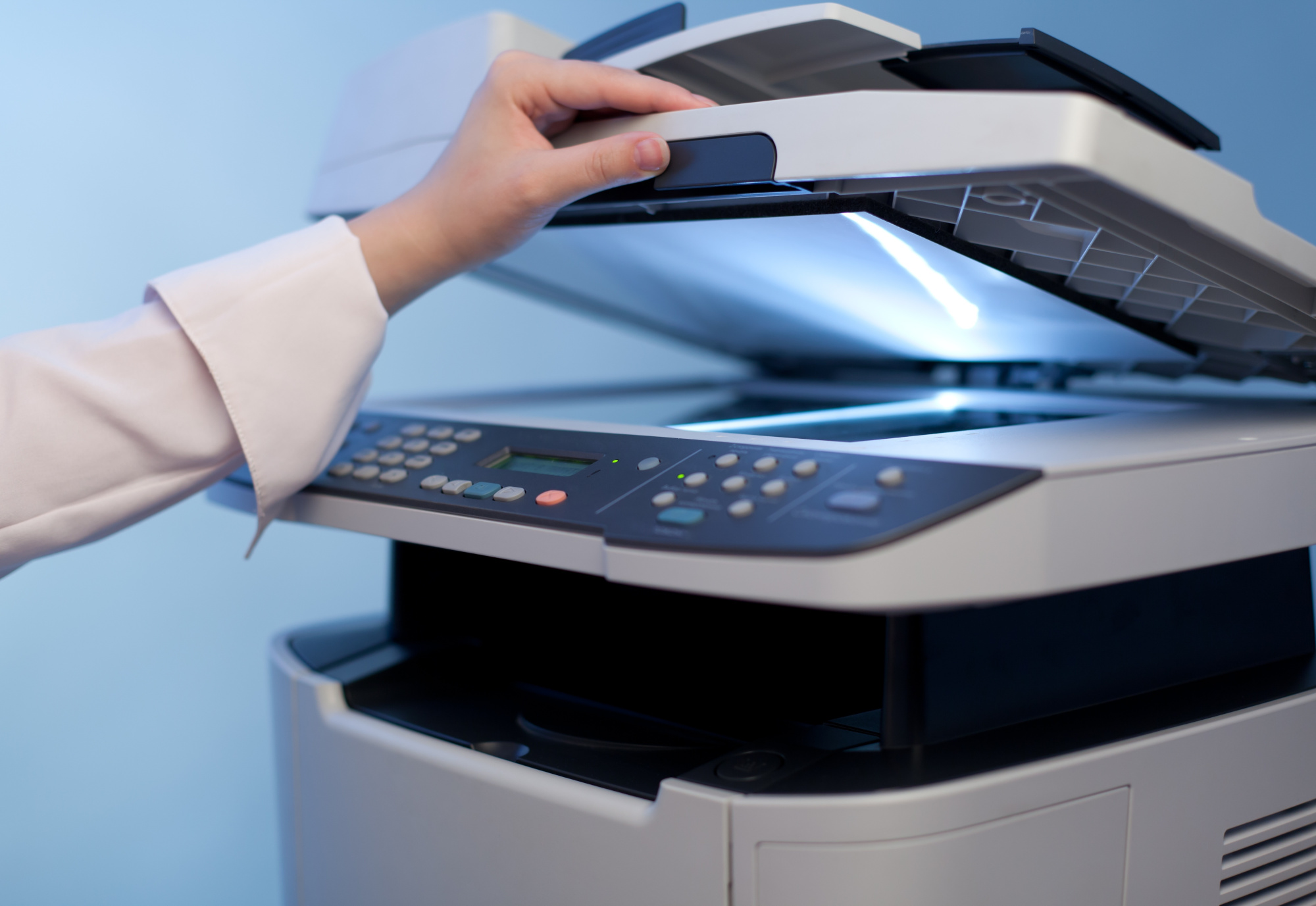 Closeup of and office grade printer/copier being opened